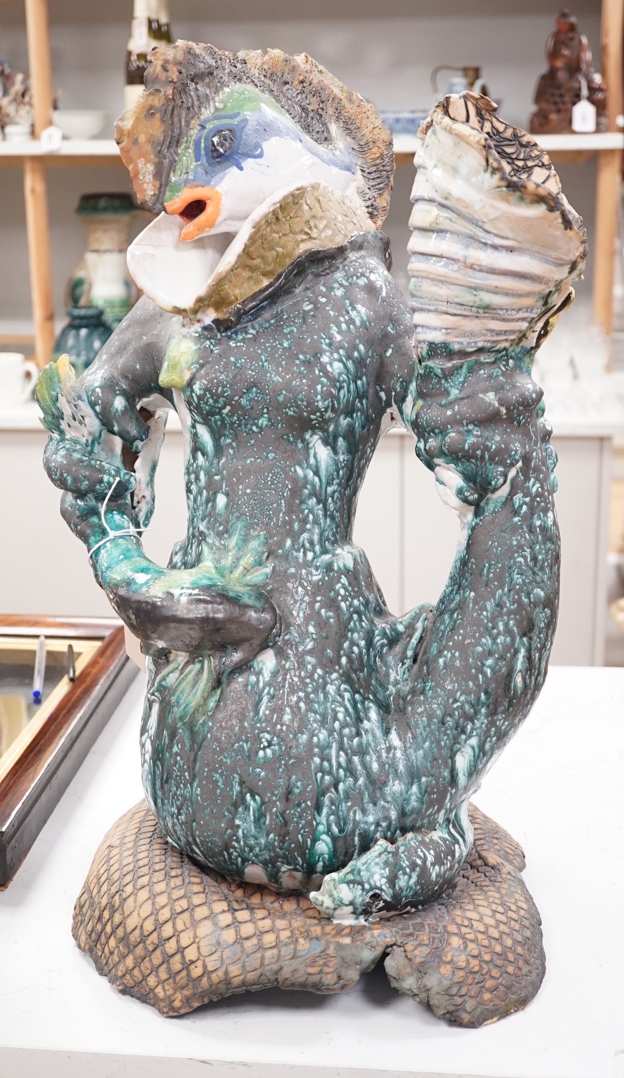 A large ceramic mer-creature sculpture, 58cm